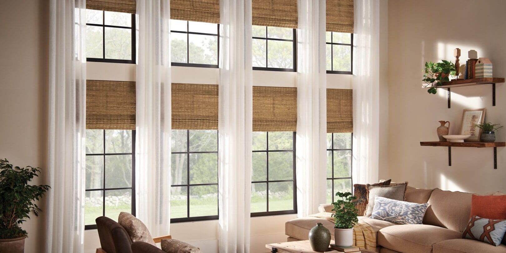 Living room with large windows and blinds.